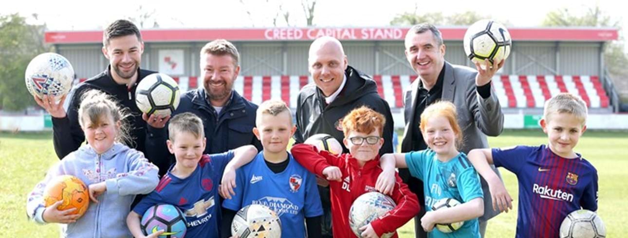 Shildon AFC children taking part in football holiday activities with Shildon AFC, Livin and Foundation of Light staff members