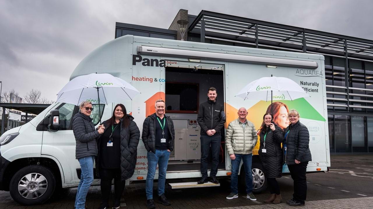 Livin staff standing in front of Panasonic training van
