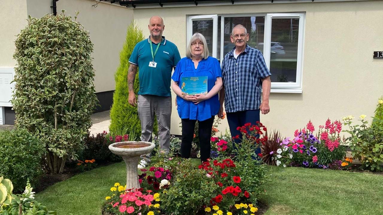 Pictured left to right: Colin Muir (Grounds Maintenance Contract Co-ordinator), Valerie Turner (Livin tenant) and Roy Turner (Livin tenant)