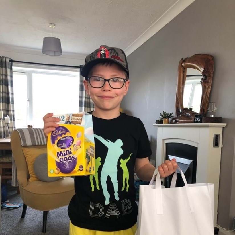 A child with his Easter gifts provided by the community