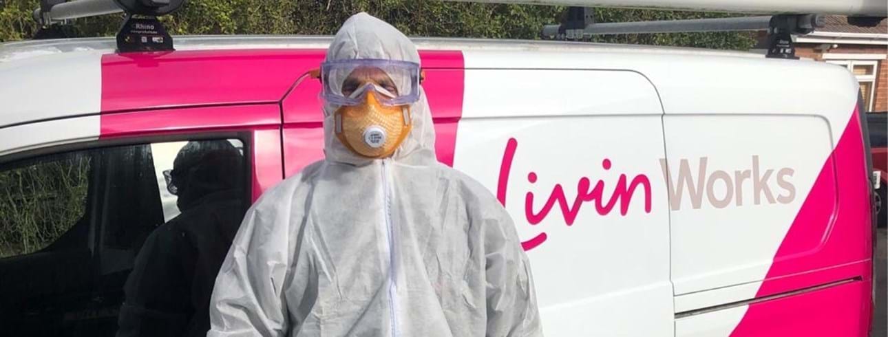 A Livin Works staff member equipped in full PPE, ready to enter customers properties