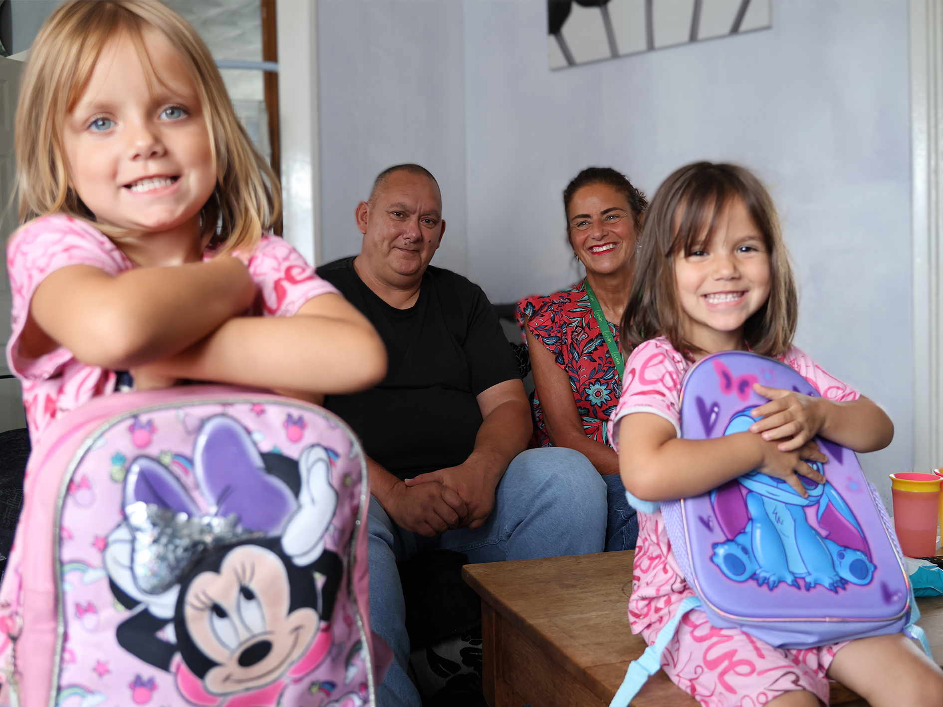 Two young girls excited with there new school backpacks