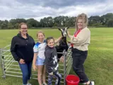Pictured: left to right, Julie O'Connor (Community Regeneration Adviser), Lyla Dodsworth, Delilah Fox, Jessie the goat and Jade Kemp (Jubilee Field Community Centre Volunteer).