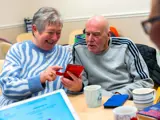 Older couple looking at a smartphone