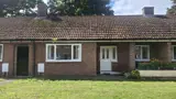 [front view of bungalow at The Park] 